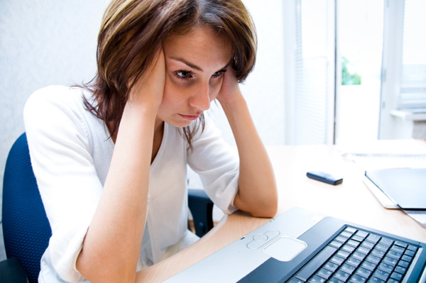 Frustrated-Woman-at-Computer-Negative-Google-Reviews